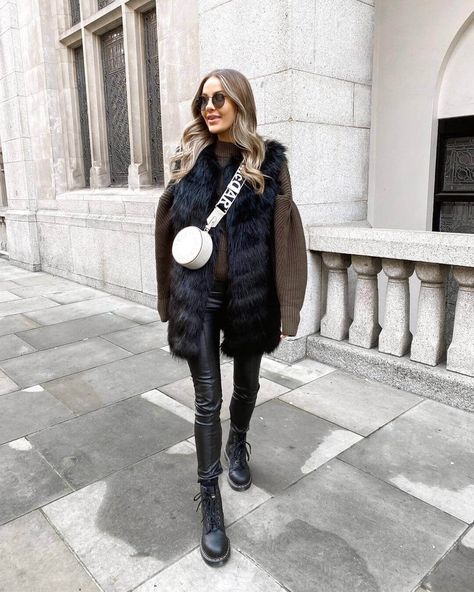 10 Ultra Chic Ways To Wear Combat Boots This Winter Vests Outfits, Black Fur Vest Outfit, Black Combat Boots Outfit, Faux Fur Vests Outfits, Nadia Anya, Winter Going Out Outfits, Fur Vest Outfits, Sleek Outfit, Black Fur Vest