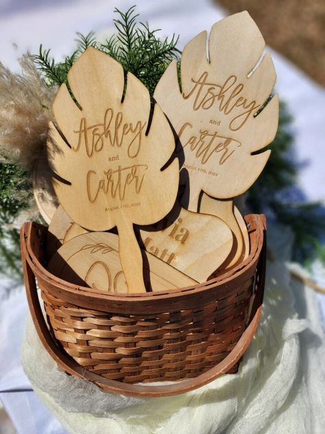 "♥ ♥ These are wooden fans, laser engraved with your custom information. ♥ They are the perfect favor for an outdoor wedding or event, and make a great souvenir. ♥ They measure approx 9.5 in (length) x 6 in (width) ♥ Personalized and Engraved with name & date or short phrase. Text is only engraved on one side. The other side is blank. ♥ These are fully functional and sturdy fan but yet light to hold, perfect for an outdoor wedding or event and will be appreciated by guests. ♥ Made with smooth 1/ Wooden Fan Wedding Favors, Laser Engraved Gifts Koyal Wholesale Weddings, Bamboo Wedding Favors, Laser Engraved Gifts Wedding Favors, Glowforge Wedding Favors, Laser Engraved Wedding Decor, Wooden Wedding Favors, Laser Engraving Wedding Ideas, Laser Cut Wedding Favors