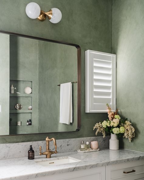 Green limewash paint, rich tiles, and striking acid washed tapware come together to create an organic atmosphere, enhancing daily routines, turning them into moments of relaxation and self-care. 📷: @hannahpuechmarin #TimelessInteriors #DesignInspiration #BathroomDesign #LuxuryLiving Limewash Walls Powder Room, Gray Limewash Bathroom, Limewash Small Bathroom, Limewash Powder Bath, Blue Limewash Bathroom, Light Green Limewash, Olive Green Limewash, Lime Washed Bathroom, Lime Wash Walls Green