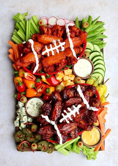 Feb 5, 2021 - Serve up homegating snacks your team can't wait to tackle with this Chicken Wings Snack Board. Fresh veggies and saucy wings are a winning combination! Chicken Wing Tray Ideas, Unconventional Charcuterie Board Ideas, Charcuterie Board Ideas Football Game, Charcuterie Football Board Ideas, Super Bowl Snack Board, Eagles Appetizers, Football Charcuterie Boards, Football Food Charcuterie Board, Wings Board Ideas