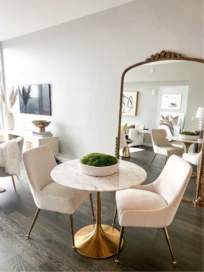 Gold marble dining table Dining chairs WAYFAIR Anthropologie mirror Living room Aparment decor Dining area #LTKstyletip #LTKhome Dining Chairs Marble Table, Dinning Room Design Small Apartment, Mini Living And Dining Room Ideas, Anthropologie Mirror Dining Room, Dining Room Design Mirror, Small Marble Dining Table, Apartment Dining Room Table, Mirror In Dining Area, Modern Dining Room Apartment