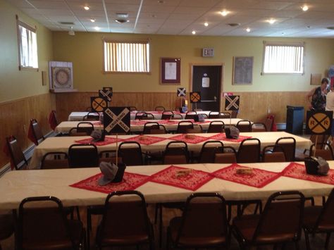 This was a railroad themed retirement party - red hankies were used as table runners and "railroad" signs were put on dowel rods, held into place by styrofoam, that I hid with stones Railroad Retirement Party Ideas, Retirement Reception, Railroad Signs, Train Party Ideas, Community Festival, Retirement Party Ideas, Retirement Ideas, Train Party, 80th Birthday Party