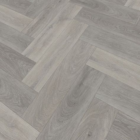 Flaming Oak Herringbone takes inspiration from the natural beauty of wood, combining a crisp texture and worn light grey colour to bring a modern style to your home. #laminateflooring #Flooring #FlooringTrends #WoodFlooring #Home #InstaHome #Interiors #Laminate #Vinyl #InteriorDesign #Decor #Decorating #HomeDecor #Renovating #cheapflooring #LivingRoom #herringbone Vinyl Flooring Herringbone, Grey Herringbone Floor, Flooring Herringbone, White Laminate Flooring, Laminate Hardwood Flooring, Herringbone Wood Floor, Underfloor Heating Systems, Herringbone Floor, Flooring Trends