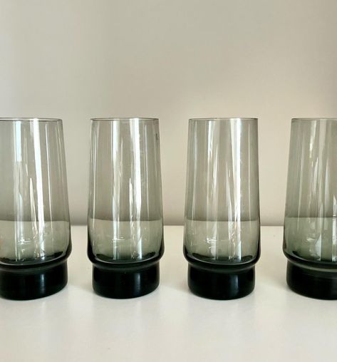 1970s barware. Set of 4 mid century smoked glass tumblers. high. Vgc. £38 PM if interested #vintageglass #sustainablegiftware #prettyglass #20thCentury#vintage #midcenturymodern#midcentury #glassware #mcm #70’s #libbey #tumblers #smokedglass #vintagebarware Glass Tumblers, Vintage Barware, Glass Tumbler, Midcentury Modern, Barware, Beauty Book, 1970s, Tumbler, Accessory Gift