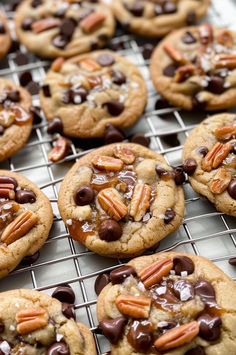 These Salted Caramel Pecan Chocolate Chip Cookies are the perfect combo of sweet, salty, crunchy, and chewy. Loaded with chocolate chips, pecans, and caramel sauce, and finished with a sprinkle of sea salt, these cookies will satisfy all your cravings. They’re easy to make and great for sharing (or keeping all to yourself!). Get the full recipe and start baking these delicious cookies today! Pecan Chocolate Chip Cookies, Pecan Chocolate, Chocolate Chip Pecan Cookies, Salted Caramel Cookies, Caramel Chocolate Chip Cookies, Carrot Cake Cheesecake, Caramel Cookies, Salted Caramel Chocolate, Delicious Cookies