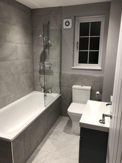 Re fitted bathroom with floating vanity unit and tiles bath panel. Bathroom With Bath Tub Ideas, Bathroom Ideas Small With Bath, Dark Grey Wall Bathroom, Bathroom Uk Ideas, Bathroom Wallpaper And Tile, Standard Bathroom Ideas, Small Bathroom With Bathtub Ideas, Half Bathroom Tile Ideas, Uk Bathroom Ideas