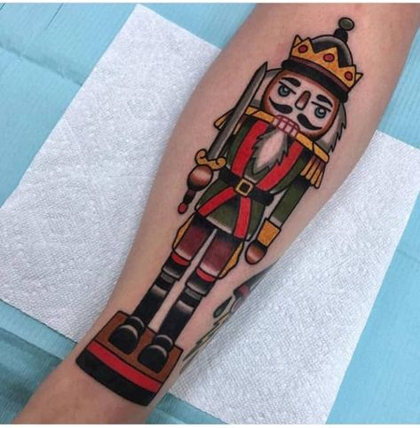 39 Christmas Tattoos You are Definitely Going To Love - The XO Factor Nutcracker Tattoo, Ballet Tattoos, Christmas Tattoos, Xo Tattoo, Soldier Tattoo, Traditional Tattoo Inspiration, Christmas Tattoo, C Tattoo, Old School Tattoo Designs