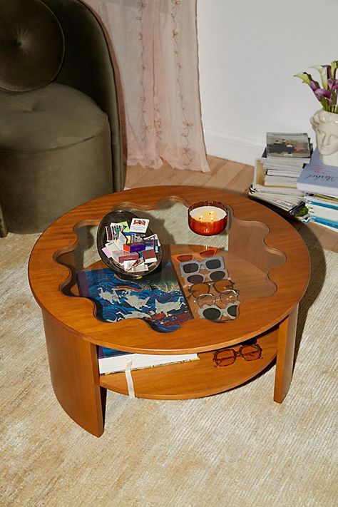 Bring cottage-ready charm to your living space with this eye-catching coffee table. This coffee table with a storage shelf below the table showcases a curving silhouette with a wavy, tempered glass tabletop. Available exclusively at Urban Outfitters. Features Stacie Coffee Table from UO Home’s Stacie furniture collection Coffee table with storage is perfect for your smaller spaces Tempered glass tabletop in a wavy, flower-like shape One fixed shelf to display your coffee table books, candles & other trinkets Removable legs so you can easily move your coffee table throughout your space Assembly required UO exclusive Content + Care Assembly required - assembly instructions and hardware are included Acorn/Natural: Solid rubberwood, MDF, rubberwood veneer, bentwood, 5mm tempered glass Painted: Coffee Table Urban Outfitters, Tall Coffee Table, Coffee Tables Modern, Uo Home, Unique Coffee Table, Apartment Style, Small Coffee Table, Table Books, Apartment Furniture