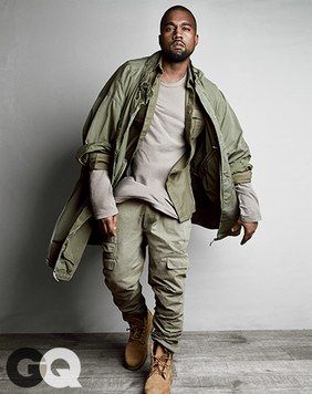 Break New Ground (But Keep It Grounded) Kanye's Take: "Military green is classic, masculine, not too trendy—all the stuff men's clothes are supposed to be."  _Military shirt, $1,055 by Balmain T-shirt, $55 by James Perse Pants, $575 by Michael Bastian Boots, $190 by Timberland Coat, vintage _ Military Fashion Menswear, Kanye West Outfits, Kanye Fashion, Kanye West Style, Mode Hip Hop, Yeezy Fashion, Estilo Hipster, What To Wear Today, Men Fashion Casual Outfits