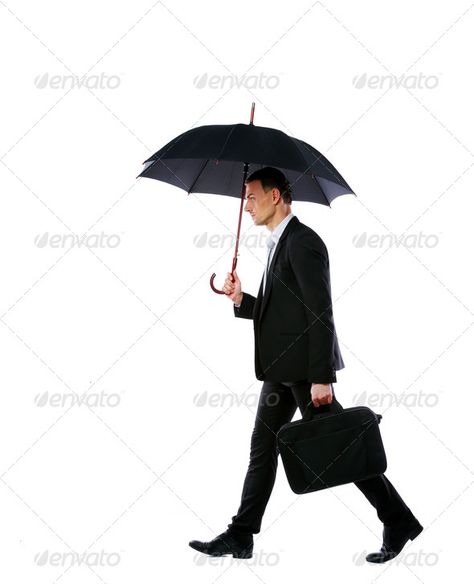 Businessman walking with umbrella and laptop bag isolated on a white background by vadymvdrobot. Businessman walking with umbrella and laptop bag isolated on a white background#umbrella, #laptop, #Businessman, #walking Person Walking With Umbrella, Walking References, Walking With Umbrella, Luxury Fonts, People Inspiration, Walking Poses, Business Logo Inspiration, Umbrella Man, Luxury Font