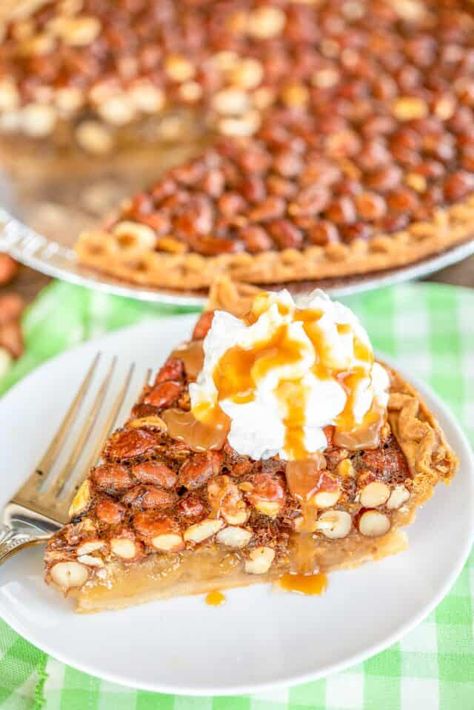 Georgia Peanut Pie - very similar to a pecan pie but with raw peanuts! SO good! This pie is SO easy to make - just whisk together eggs, vanilla, sugar, and corn syrup. Stir in the raw peanuts and pour into a frozen deep-dish pie crust. Top baked pie with some vanilla ice cream or fresh whipped cream. Can make in advance and store in an air-tight container. Peanut Pie Recipe, Whipped Cream Pie, Peanut Pie, Raw Peanuts, Plain Chicken, Pie Tops, Desserts For A Crowd, Pie Tart, Meringue Pie