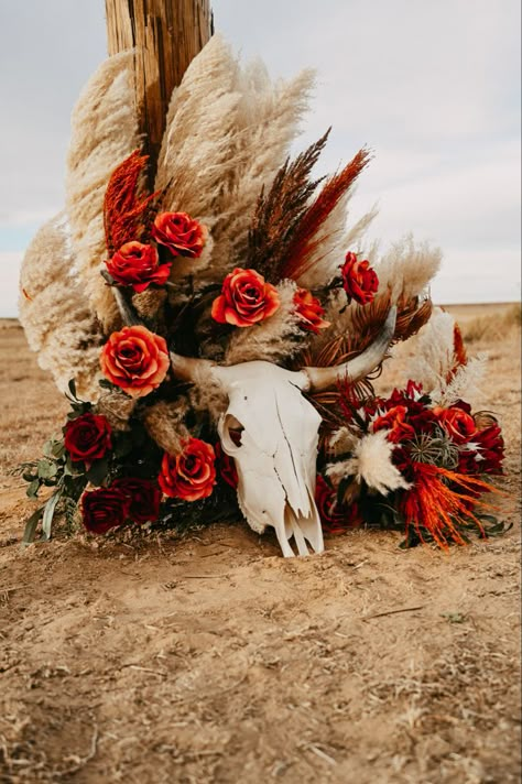 Western photography western wedding longhorn skull burnt orange florals pampas grass fake flowers Western Pampas Grass Decor, Western Wedding Burnt Orange, Western Halloween Wedding, Bull Skull Wedding Decor, Red Western Wedding Theme, Burnt Orange Country Wedding, Orange Western Wedding, Western Isle Decorations, Cow Skull Wedding Decor