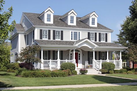 What an absolutely gorgeous home in light gray with plenty of bright white trim then contrasted perfectly with black exterior shutters and a bright red door. Exception attention to detail was given this home. Soggy Yard, Exterior Updates, Window Shutters Exterior, Different House Styles, Vinyl Shutters, Black Shutters, Diy Shutters, Front Porch Design, Suburban House