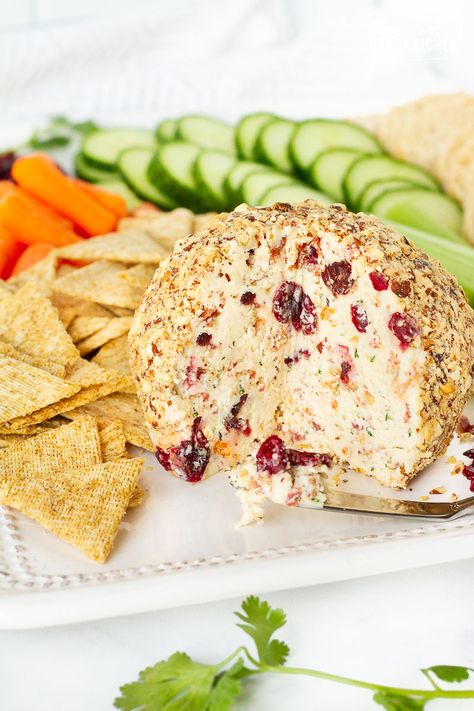 This Cranberry Almond Bacon Cheese Ball is the perfect appetizer for the holidays. Festive colors and flavors make this a brilliant buffet centerpiece for any occasion! #cranberry #almond #bacon #cheese #cheeseball #cranberryalmondcheeseball #baconcheeseball #holidayappetizer #appetizer #FavoriteFamilyRecipes #favfamilyrecipes #FavoriteRecipes #FamilyRecipes #recipes #recipe #food #cooking #HomeMade #RecipeIdeas Cheese Ball Easy, Bacon Cheese Ball, Buffet Centerpiece, Thanksgiving Appetizers Easy, Christmas Appetizers Easy, Christmas Appetizer, Delicious Dips Recipes, Holiday Appetizers Easy, Appetizer Sandwiches