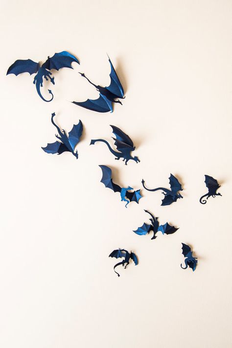 This stunning 3D wall art will keep your house feeling like home. | 22 Badass Items Every Mother Of Dragons Needs Mythical Room Decor, Fantasy Cafe, Game Of Thrones Decor, Purple Dragons, Boys Room Blue, Game Of Thrones Party, Dragon Wall Art, Dragon Silhouette, 3d Dragon