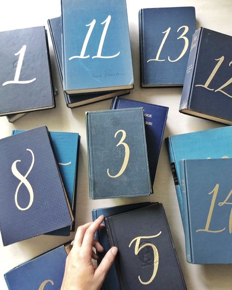 Book Table Number, Wedding Table Numbers Books, Book Table Numbers Wedding, Book Table Numbers, Hall Decorations, Wedding Hall Decorations, Book Table, Invitation Calligraphy, Setting Ideas