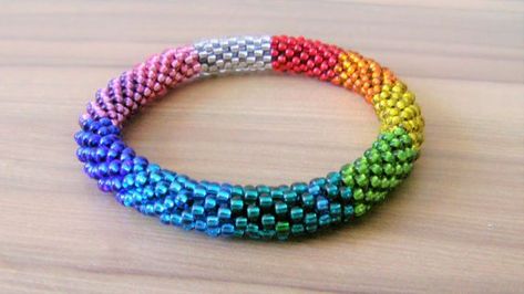 How To Make A Seed Bead Rope Bracelet - YouTube Round Seed Bead Bracelet Diy, Cord And Bead Bracelets, Rope Bead Bracelet, Crochet Beaded Rope Patterns Free, Beaded Rope Tutorial, Seed Bead Patterns Free Bracelets, Rope Bracelets Tutorial, Seed Bead Rope, Rope Bracelets Diy