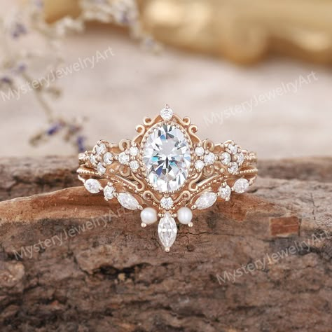 Vintage Moissanite Engagement Ring Set Rose Gold Ring Set Pearl Ring Bridal Set Moissanite Cluster Ring Diamond Ring Promise Rings for Women Only 1pcs Engagement Ring: https://www.etsy.com/listing/1615421111 Only 1PCS Wedding Band: https://www.etsy.com/listing/1586494152  💎RING DETAILS  Material: 10K/14K/18K yellow gold, white gold, and rose gold are available. (Other metals and stones are also available, please feel free to contact me directly for sterling silver or platinum.) ------ ENGAGEMENT RING ------ ◈ Center Stone: Moissanite ◈ Shape: Oval Shaped ◈ Size: 5x7mm ◈ Accent Stone: Moissanite or Diamond ◈ Shape: Round cut ◈ Weight: Moissanite About 0.14ct ◈ Bandwidth - 1.5mm ------ WEDDING BAND ------ ◈ Stones: Freshwater pearl & Moissanite or Diamond ◈ Shape: Round & Marquise cut ◈ Wei Sagittarius Engagement Ring, Unique Wedding Rings Engagement Gold, Antique Engagement Rings Vintage 1920s, Vintage Wedding Rings 1920s, Floral Wedding Rings, Boho Wedding Rings, Engagement Rings Etsy, Vintage Marquise Engagement Ring, Western Wedding Rings