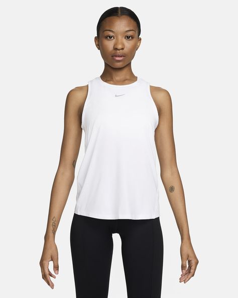 Up for a workout or down to chill, this Nike One Classic tank top is ready for whatever you are. Lightweight, silky-smooth fabric dries quickly and works for wherever your day takes you. A timeless, easy-fitting style and sweat-wicking tech help you feel confident, comfortable and dry from your morning stroll to your evening wind-down—and at all the stops in between. Shown: White/Black Style: FN2808-100 Top Nike, Nike Tank, Nike Tank Tops, White Nike, A Workout, Workout Tank Tops, Black Style, White Nikes, Nike Dri Fit