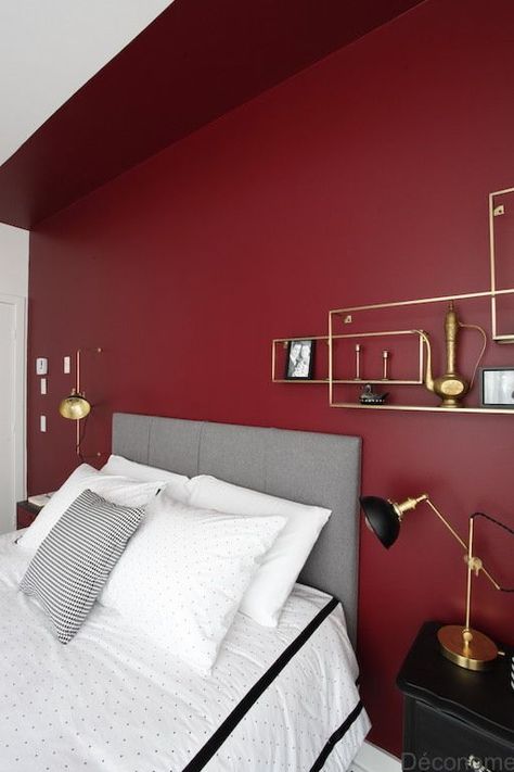 a bold modern bedroom with a burgundy accent wall, a grey bed, black nightstands and touches of gold or a chic look Red Bedroom Walls, Burgundy Bedroom, Red Bedroom Design, Red Accent Wall, Red Bedroom Decor, Brass Shelves, Bedroom Wall Colors, Dekorasi Kamar Tidur, Red Bedding