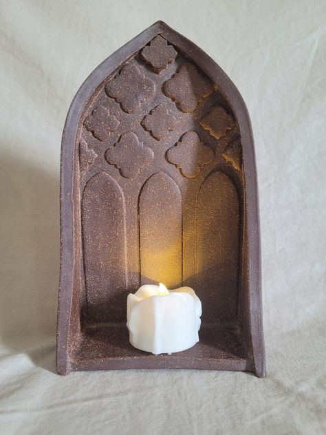 This medieval-inspired table shrine is a versatile piece that can be used for many purposes: spiritual practices and rituals, enshrining memories, elegant décor, and more. Please note that there is no hole in the piece to allow it to be hung on the wall. Tealight candle not included. Shrines And Altars Ideas Spiritual, Ceramic Shrine, Candle Shrine, Clay Homes, Ceramic Altar, Medieval Candle, Wall Shrines, Medieval Home Decor, Gothic Candle