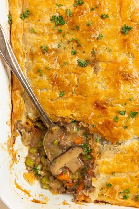 With ground beef and vegetables simmered in a rich gravy and baked between a flaky top and bottom crust, this easy ground beef pot pie is filling, flavorful, and quick enough for a weeknight dinner. Ground Beef Pot Pie, Ground Beef And Vegetables, Beef Pot Pie, Dinner Recepies, Beef And Vegetables, Pie From Scratch, Beef Pot Pies, Easy Ground Beef, Homemade Dinner Recipes