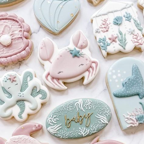 Lindsay Johnson on Instagram: "I missing the ocean and wishing we could go back! But these sweet under the sea cookies for a baby shower sure make me smile! Inspo credit to @oh.sugar.cookieco and @themillerswifecustomcookies Clam, octopus, and jellyfish are my cutter designs. The rest are tagged! . #undertheseacookies #oceancookies #beachcookies #oceanbabyshower #undertheseababyshower #beachbabyshower #babycookies #babygirlcookies #babyshowerideas #babyshowercookies #whalecookies #turtlecooki Two The Sea Cookies, Under The Sea Girl Baby Shower Theme, Under The Sea Baby Shower Cookies, Under The Sea Baby Shower Ideas For Girl, Octopus Cookies, Galletas Aesthetic, Ocean Cookies, Under The Sea Cookies, Sea Baby Shower Theme