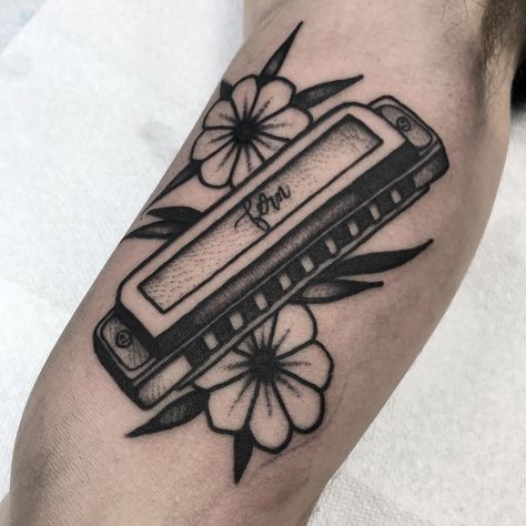 Blackwork style harmonica tattoo Harmonica Tattoo, Traditional Tattoo Music, Cassette Tattoo, Sailor Jerry Tattoos, Traditional Tattoo Sleeve, Traditional Tattoo Art, Old Tattoos, Jewelry Tattoo, Music Tattoos