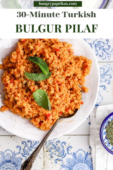 White plate with turkish bulgur pilaf and a fork Caption reads: 30-Minute Turkish bulgur pilaf Coarse Bulgur Recipe, Bulgur Pilaf Recipes, Red Bulgur Recipes, Turkish Bulgur Pilaf, Turkish Bulgur Recipes, Hungry Paprikas, Bulgar Recipes, Barley Pilaf, Turkish Rice