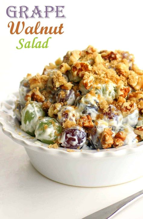 This Grape Salad is a unique fruit salad that is always a crowd pleaser and great for potlucks! Red and green grapes with brown sugar, pecans or walnuts, cream cheese, and sour cream. #potluck #side #salad #fruit Grape And Walnut Salad, Walnut Grape Salad, Grape Salad With Cream Cheese, Brown Sugar Pecans, Sugar Pecans, Grape Salad Recipe, Sugared Grapes, Unique Fruit, Walnut Recipes