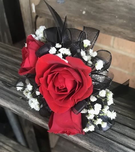 Red Spray Roses with Babies Breath and Black ribbon. Black And Red Corsage, Boutonnière Ideas, White Wrist Corsage, Red Corsages, Black Corsage, Prom Bouquet, Hoco Ideas, Rose Corsage, Corsage And Boutonniere