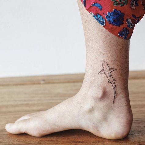 s t i c k   &   p o k e. on Instagram: “Little sharky for Hayley 🦈 @hailsxlxb” Subtle Ocean Tattoo, Shark Ankle Tattoos For Women, Ankle Shark Tattoo, Ocean Tattoos Leg, Minimalist Shark Tattoo, Shark Tattoo Minimalist, Minimalist Ocean Tattoo, Kalula Tattoo, Tiny Shark Tattoo