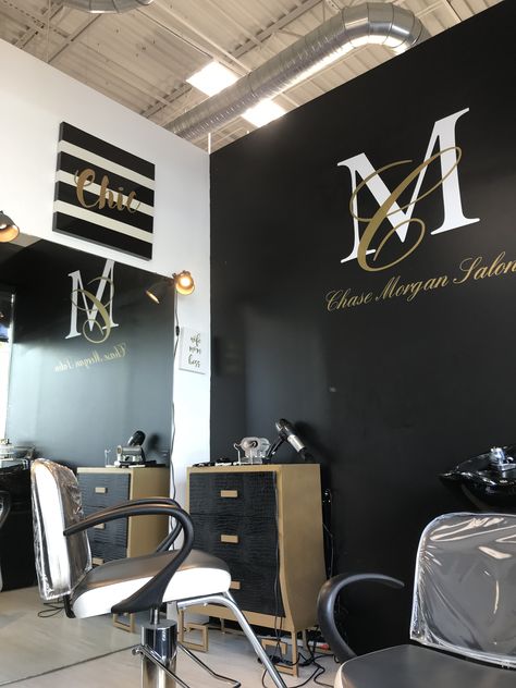 Black White And Yellow Hair Salon, Black Wall Salon Decor, Black White And Gold Salon Suite, Black And Gold Nail Salon Decor, Black White And Gold Salon Suite Ideas, Small Home Hair Salon, Salon Feature Wall Ideas, Black And Gold Hair Salon Decor, Salon Suite Decor Small Spaces Glam