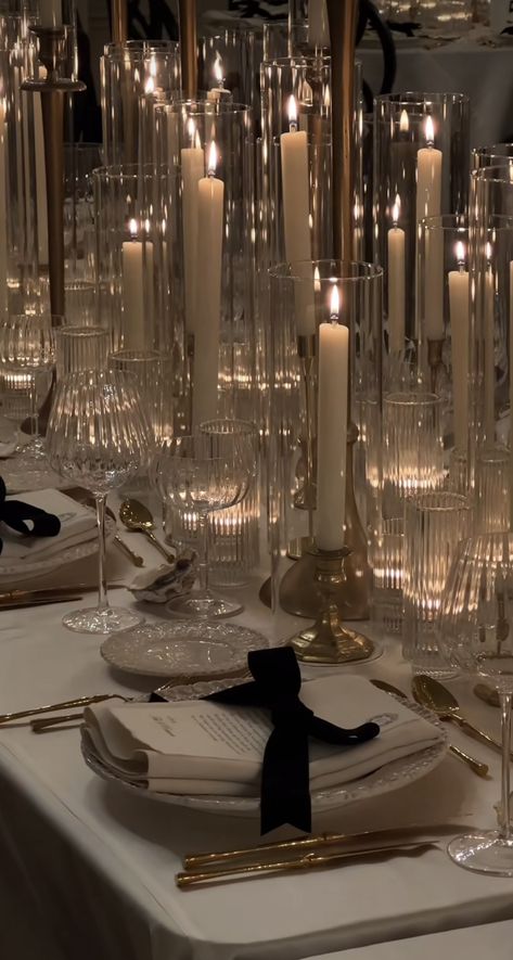 Standing Tables Party, Moody Table Settings Wedding, Black Attire Wedding Decor, Italy Wedding Centerpieces, Floating Candles With Pearls, Brass And Glass Candlesticks Wedding, Crystal Table Decor Wedding, Glitz And Glam Table Decorations, Nye Party Table Decorations