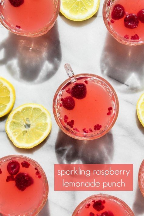 sparkling raspberry lemonade punch is an easy, refreshing drink for summertime celebrations! with both a mocktail and cocktail version, this drink recipe is perfect for a baby shower, bridal shower, party or as a refreshing drink on a hot summer afternoon. Best Baby Shower Food, Raspberry Lemonade Punch, Baby Shower Food Ideas, Shower Food Ideas, Lemonade Punch, Basil Lemonade, Pumpkin Beer, Vodka Cocktails Recipes, Frozen Cocktails