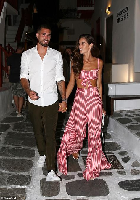 Perfect pair: German footballer Kevin, 30, cut a more casual figure in a combination of ol... Red Striped Top Outfit, Flare Palazzo Pants, Striped Top Outfit, Striped Palazzo Pants, Red Stripes Top, Izabel Goulart, Holiday Lookbook, Striped Two Piece, Preppy Women