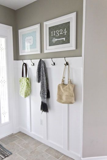 another angle of this entryway. Loving the hooks, the chair rail, the colour, the pictures - everything! Lambriseringen Gang, Concrete Basement, Formal Room, Diy Wainscoting, Young House Love, Basement Ceiling, Basement Walls, Mud Rooms, Bench Ideas