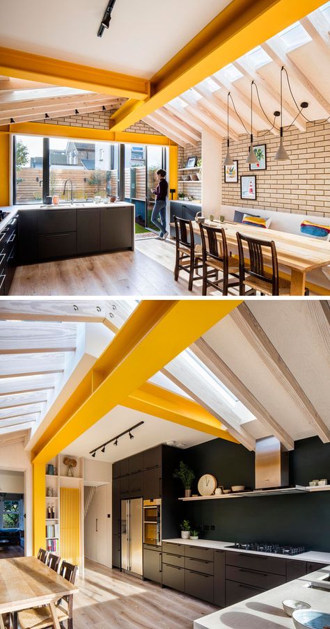 Inside this brick extension by Woodrow Architects, large yellow steel beams provide support, while unconnected rafters sail over with steel plate apex connections allowing the design to do away with any ridge beam.# #YellowBeams #BlackKitchen #BrickExtension  Visit Woodrow Architect's website here > https://www.wdrw.co.uk Dark Wood House, London Terrace House, Brick Extension, Wood Interior Design, House Extension Design, Rear Extension, Steel Beams, Wood House, London House