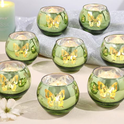 PRICES MAY VARY. ❤️Green Votive Candle Holders-Perfect for Vintage Home Decor and Green Wedding Theme Parties: This glass votive candle holder with unique butterfly pattern is of high quality. When lit, it projects beautiful butterfly light, creating a dreamy and charming atmosphere for you. ❤️Perfect Green Candleholders Decoration：Use this green candle holder at your wedding or dining table, with beautiful butterflies dancing, creating a romantic and unique atmosphere for you. It is especially Fairy Tea Party Table Decor, Princess Tiana Table Decor, Princess And The Frog Center Piece, Fairy Garden Table Centerpiece, Cottage Core Table Decor, Nature Themed Sweet 16, Quince Butterfly Theme Centerpieces, Princess And The Frog Wedding Theme Ceremony Decor, Princess And The Frog Sweet 16 Decor