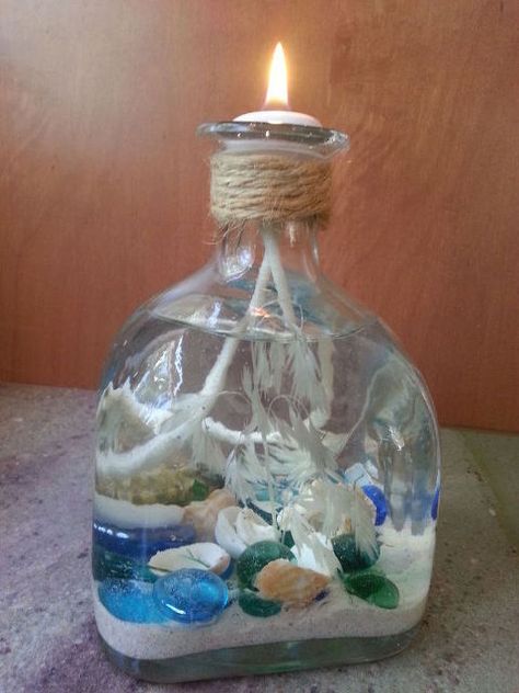 liquor bottle repurpose coastal candle, crafts, how to, repurposing upcycling Beach Memory Jars, Liquor Bottle Candles, Old Liquor Bottles, Coastal Table Decor, Empty Liquor Bottles, Anchor Crafts, Coastal Candle, Sand Vase, Liquor Bottle Crafts