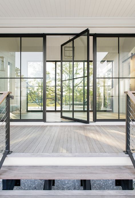 One family’s Fresh Start with custom-designed digs on Captain’s Island | Charleston SC | Charleston Magazine Master Balcony, Modern Tree House, Balcony Door, Pivot Door, House Decor Modern, Coastal Modern, Pivot Doors, Iron Doors, Indoor Outdoor Living