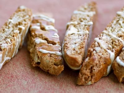 Recipe: Maple Walnut Biscotti With Maple Icing : NPR Walnut Biscotti, Christmas Biscotti, Lemon Candy, Maple Icing, Gingerbread Spice, Crystallized Ginger, Melting White Chocolate, Biscotti Recipe, Maple Walnut