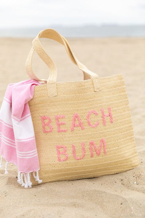 Details Beach Bum Raffia Beach Bag Woven "Beach Bum" script Tote-style with attached strap Material and Care Made of man made materials Patterns may vary Materials may have natural variations Colors may vary from different viewing devices Beach Basket Ideas, Cute Beach Bags, Raffia Beach Bag, Hawaii Clothes, Beach Basket, Pink Activewear, Hawaii Outfits, Pink Swim, Brand New Day