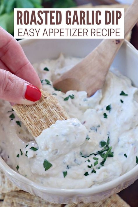 cracker dipped into creamy garlic dip in bowl with spoon Roasted Garlic Dip, Garlic Dip Recipes, Easy Roasted Garlic, Roasting Garlic, Bread Chips, Bread Crackers, Garlic Roasted Broccoli, Roasted Garlic Cloves, Delicious Dips Recipes