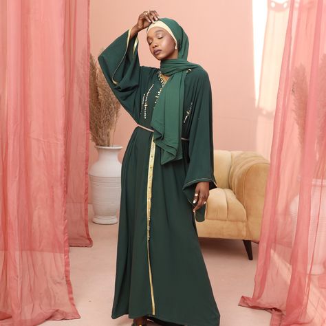 Enveloping the color of emerald, the 𝙀𝙡𝙪𝙨𝙞𝙤𝙣 𝙂𝙧𝙚𝙚𝙣 𝙊𝙘𝙘𝙖𝙨𝙞𝙤𝙣 𝘼𝙗𝙖𝙮𝙖 is a grand fusion of stitching with sophistication. 𝐒𝐌𝐀𝐌𝐙 𝐛𝐞𝐚𝐝𝐞𝐝 𝐝𝐞𝐜𝐨𝐫 𝐝𝐞𝐭𝐚𝐢𝐥𝐬 make this article the top choice for your next event! Make those perfect moments with extra-perfect attire with one click on our website! - - #smamz #modestwear #modest #fashion #style #dress #abaya #longdress #modesty #hijabfashion #hijabistyle #modesty #modest #modestclothing Beaded Decor, Dress Abaya, Hijabi Style, Decor Details, Modest Wear, Perfect Moment, Modest Outfits, Style Dress, Hijab Fashion