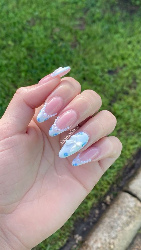 Nail Inspo White And Blue, Spring Coquette Nails, Light Blue Coquette Nails, Purple Coquette Nails, Blue Nails With Pearls, Blue And Purple Nails Designs, Coquette Nails Almond, Bridgerton Nails Ideas, Blue Coquette Nails