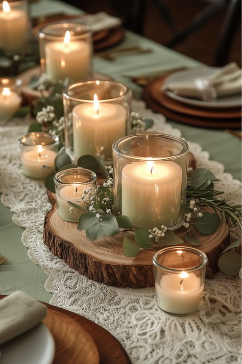 Bring warmth and rustic charm to your Sage Green Thanksgiving Table with this beautiful Rustic Sage and Wood Centerpiece! 🍃 Featuring soft sage candles, eucalyptus accents, and wood slice bases, this centerpiece adds a cozy and natural touch to any holiday gathering. Ideal for creating a welcoming, nature-inspired tablescape, this setup combines sage green elegance with rustic decor. Diner Table Centerpiece, Plants And Candles Decor, Rustic Sage Wedding Decor, Table Decor Ideas For Party, Sage Green Reception Table, Thanksgiving Table With Eucalyptus, Long Wood Table Centerpieces, Nature Christmas Table Decor, Eucalyptus Decor Ideas