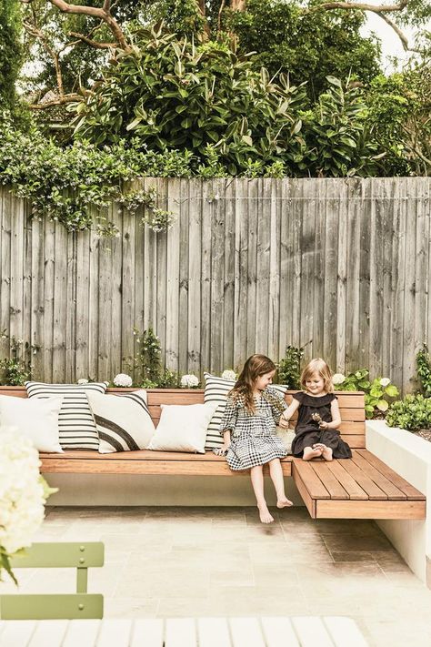 Renovated and reimagined for a growing family, this 1960s coastal duplex in Sydney is enjoying a bright and beautiful new lease of life. Built In Garden Seating, Timber Bench Seat, Built In Bench Seating, Garden Bench Seating, Outdoor Bench Seating, Outdoor Cooking Spaces, Star Jasmine, Small Courtyards, Outdoor Living Design