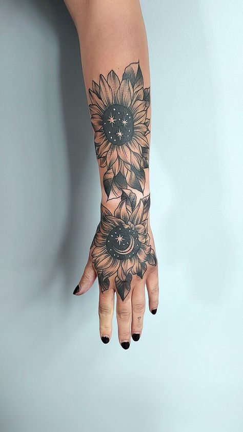 black and grey cosmic sunflower tattoo Sunflower Leg Tattoo Sleeve, Hand Tattoos For Women Sunflower, Celestial Sunflower Tattoo, Cosmic Sunflower Tattoo, Cosmic Flower Tattoo, Sunflower Hand Tattoos For Women, Hand Tattoos Floral, Gothic Sunflower Tattoo, Hand Sunflower Tattoo