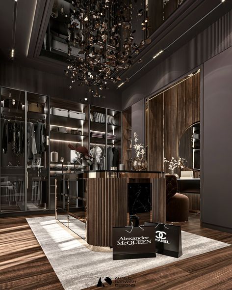 Enter a world of luxury with this dark-toned dressing room designed by the acclaimed Ahmed Darwish. The rich, deep hues create an atmosphere of sophistication and elegance, while custom cabinetry and sleek finishes provide both style and functionality. Thoughtfully arranged lighting highlights the exquisite details and enhances the room's opulent feel. 𝑫𝒊𝒔𝒄𝒐𝒗𝒆𝒓 𝒂 𝒘𝒐𝒓𝒍𝒅 𝒐𝒇 𝒅𝒆𝒔𝒊𝒈𝒏 𝒆𝒅𝒊𝒕𝒊𝒐𝒏𝒔 𝒂𝒕 @covethouse_ #CovetHouse #CovetCollection #CircuMagicalFurniture #CaffeLatteHome #CovetedMagazine... Custom Cabinetry, Dressing Table, Dressing Room, Dark Aesthetic, A World, Room Design, Highlights, Sleek, Bedroom